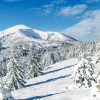 Sneeuwlandschap achter kerstdorp 58x138 cm - fotopapier